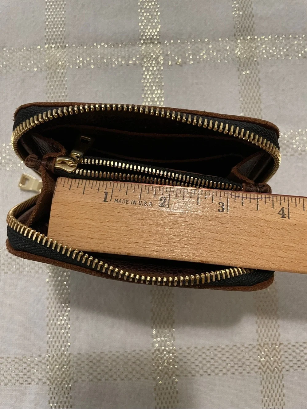 Portland Leather Goods brown wallet, gold tone zipper, inside holds coins/cards